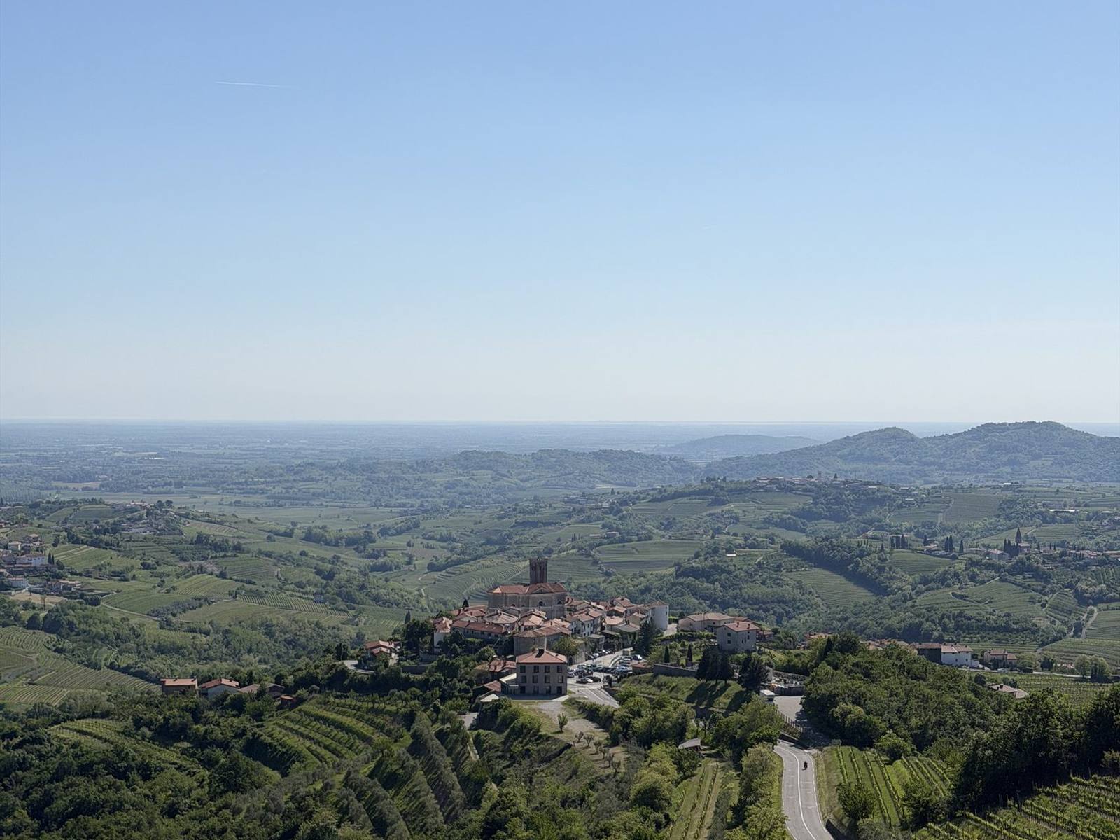 Rolling countryside with a village in the distance