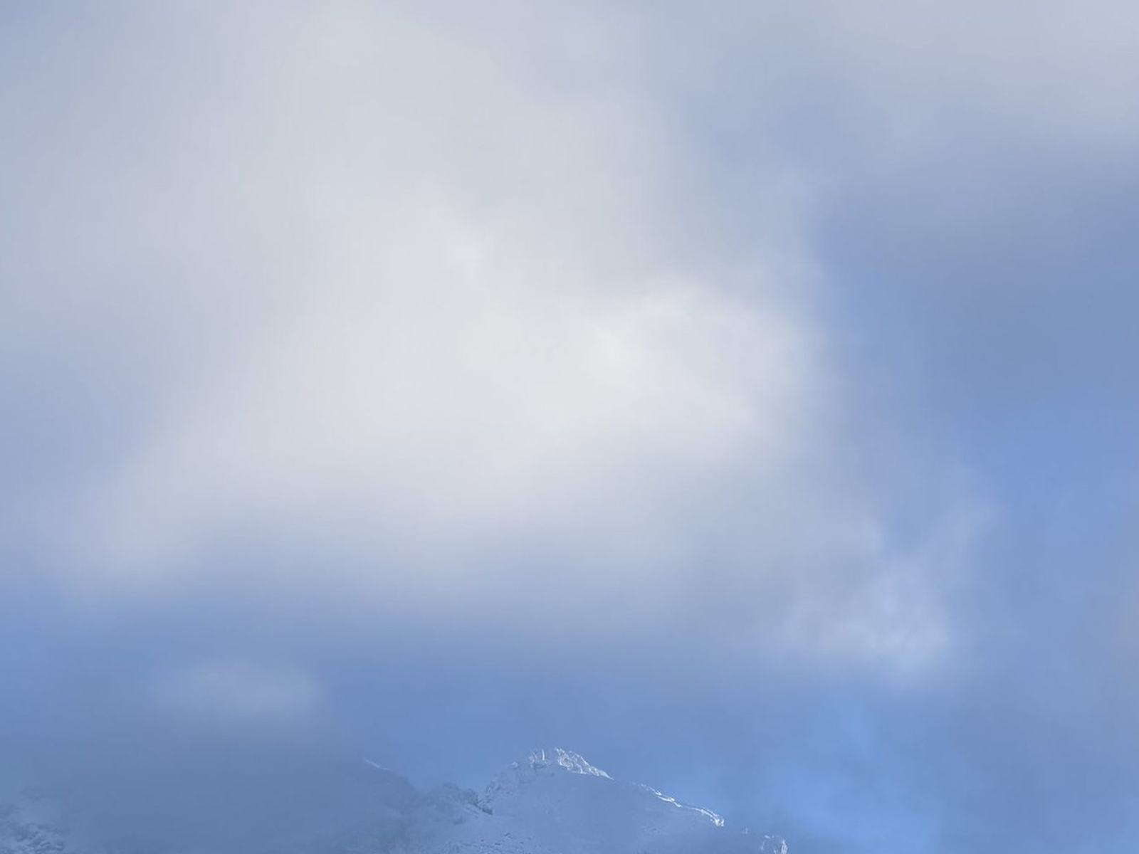 Cloud covering a mountain face