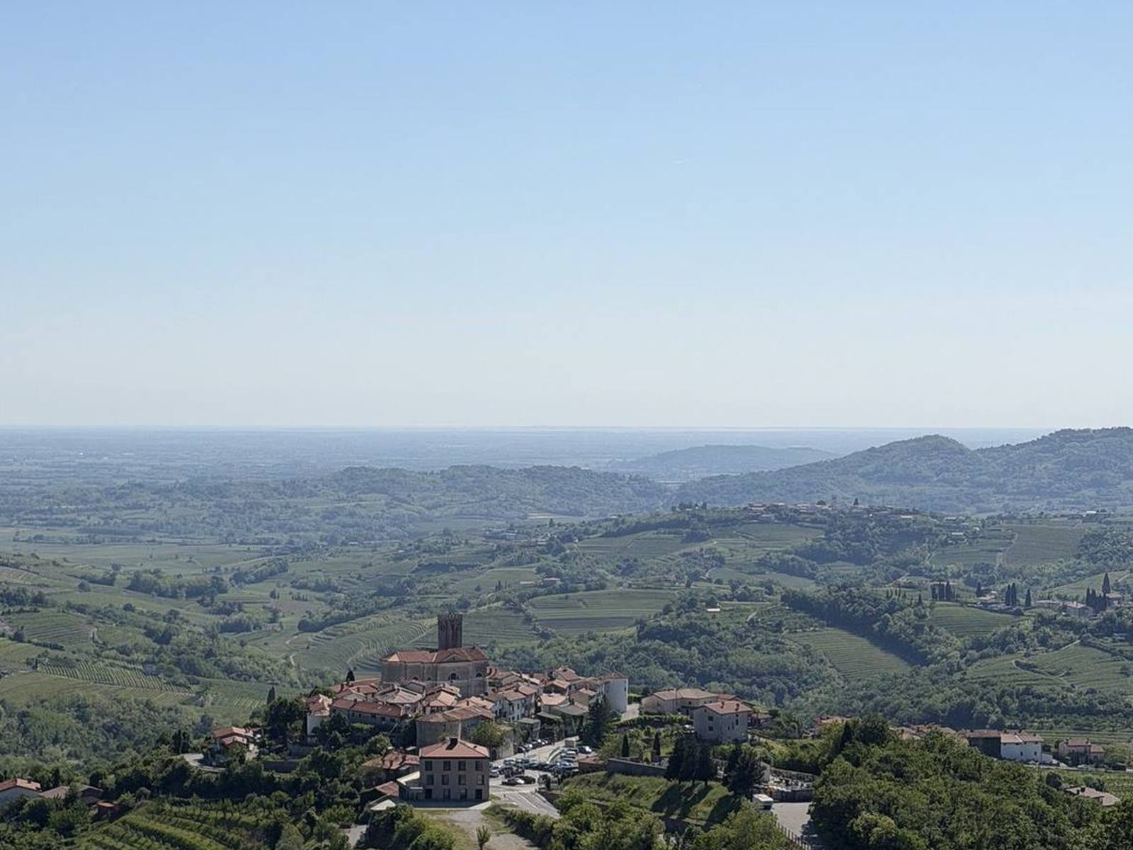 Rolling countryside with a village in the distance
